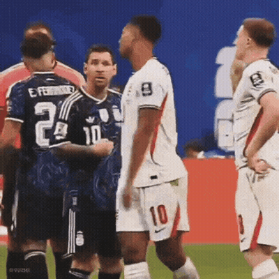 A Soccer Player With The Number 10 On His Shorts Is Standing Next To Another Player GIF