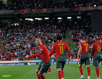 A Soccer Player With The Number 11 On His Back Is Celebrating With His Teammates GIF