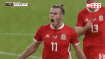 A Soccer Player With The Number 11 On His Jersey Is Celebrating GIF