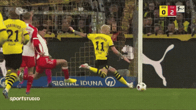 A Soccer Player With The Number 11 On His Jersey Is Kicking The Ball GIF