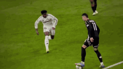 A Soccer Player With The Number 11 On His Jersey Is Running On The Field . GIF