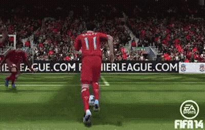 A Soccer Player With The Number 11 On His Jersey Is Running With A Soccer Ball GIF