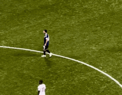 A Soccer Player With The Number 11 On His Jersey Is Surrounded By Other Players GIF