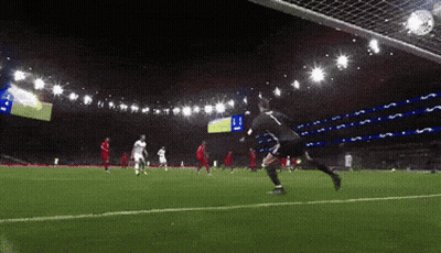 A Soccer Player With The Number 11 On His Jersey Kicks The Ball Into The Net GIF