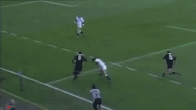 A Soccer Player With The Number 11 On His Shirt Is Laying On The Ground . GIF