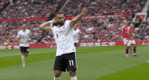 A Soccer Player With The Number 11 On His Shorts Celebrates GIF
