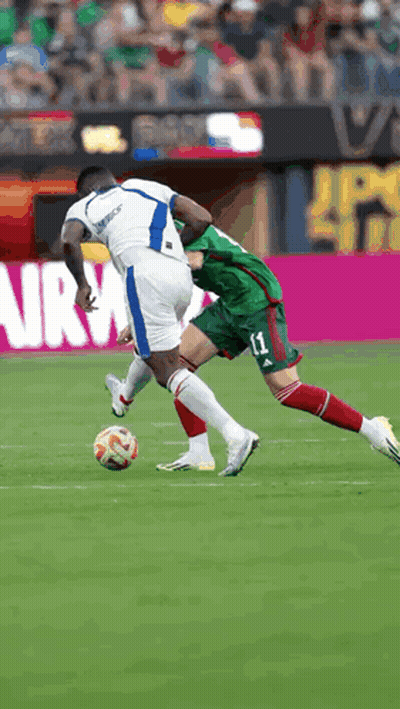 A Soccer Player With The Number 11 On His Shorts Is Trying To Steal The Ball From Another Player GIF