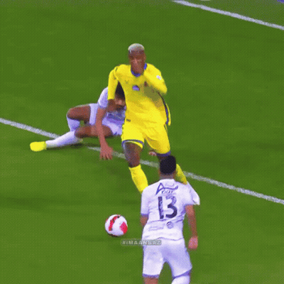 A Soccer Player With The Number 13 On His Jersey Is Kicking The Ball GIF