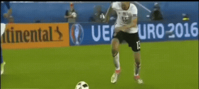 A Soccer Player With The Number 13 On His Jersey Kicks A Soccer Ball GIF