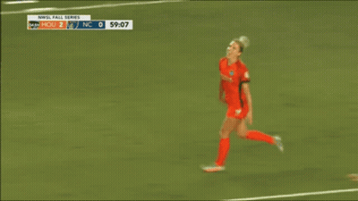 A Soccer Player With The Number 14 On Her Jersey Hugging Another Player GIF