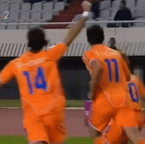 A Soccer Player With The Number 14 On His Back Is Celebrating GIF