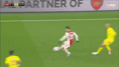 A Soccer Player With The Number 14 On His Jersey Is Dribbling The Ball GIF