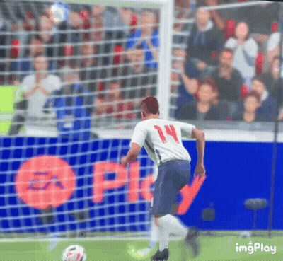 A Soccer Player With The Number 14 On His Jersey Is Kicking The Ball GIF