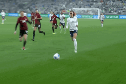 A Soccer Player With The Number 14 On His Shorts Is Falling On The Ground GIF