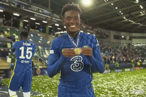 A Soccer Player With The Number 15 On His Jersey Is Holding A Medal GIF