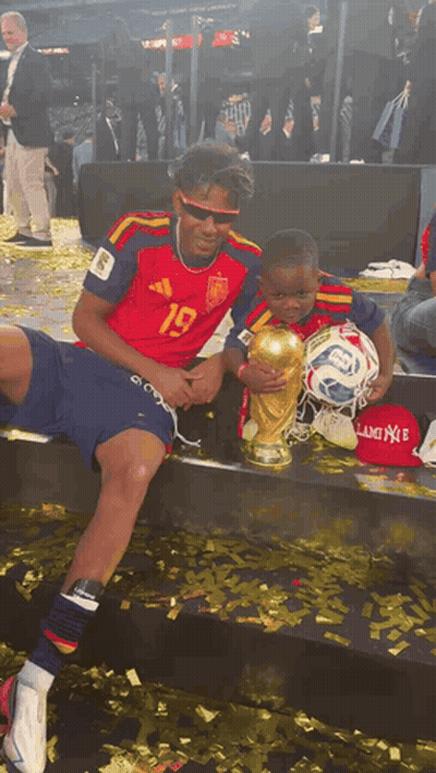A Soccer Player With The Number 19 On His Jersey Holds A Trophy GIF
