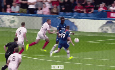 A Soccer Player With The Number 19 On His Jersey Kicks The Ball GIF
