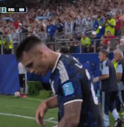 A Soccer Player With The Number 2 On His Arm Stands On The Field GIF