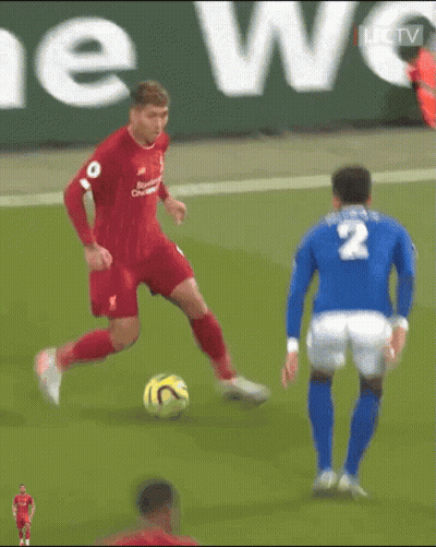 A Soccer Player With The Number 2 On His Jersey Is Dribbling The Ball GIF