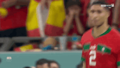 A Soccer Player With The Number 2 On His Jersey Stands In Front Of A Crowd . GIF