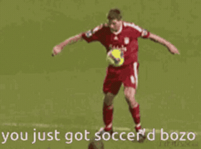 A Soccer Player With The Number 20 On His Back Is Kicking Another Player GIF