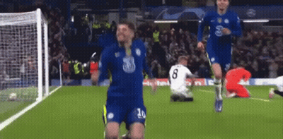 A Soccer Player With The Number 20 On His Jersey Celebrates A Goal GIF