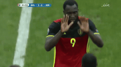 A Soccer Player With The Number 20 On His Jersey Hugs Another Player GIF