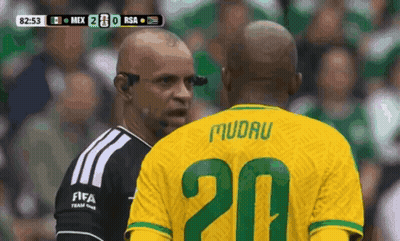 A Soccer Player With The Number 20 On His Jersey Talks To A Referee GIF
