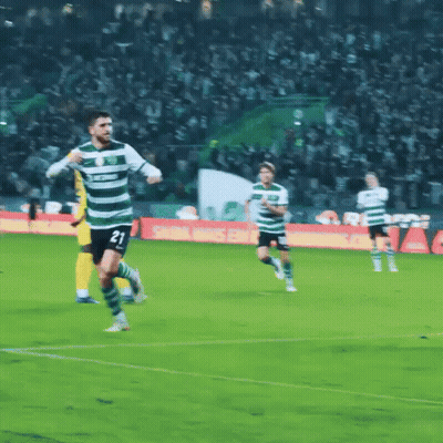 A Soccer Player With The Number 21 On His Jersey Is Running On The Field GIF