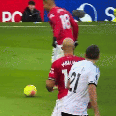 A Soccer Player With The Number 21 On His Jersey Kicks The Ball GIF