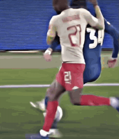 A Soccer Player With The Number 21 On The Back Of His Shirt GIF