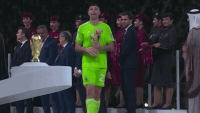 A Soccer Player With The Number 23 On His Jersey Holds A Trophy GIF