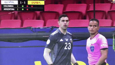 A Soccer Player With The Number 23 On His Jersey Stands Next To A Referee GIF