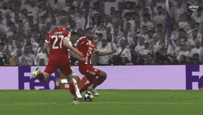 A Soccer Player With The Number 27 On His Jersey Kicking The Ball GIF