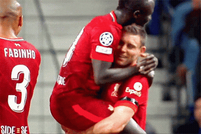 A Soccer Player With The Number 3 On His Back Is Hugging Another Player GIF