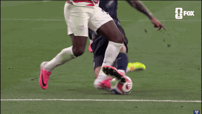 A Soccer Player With The Number 3 On His Shirt Is Being Tackled By Another Player GIF