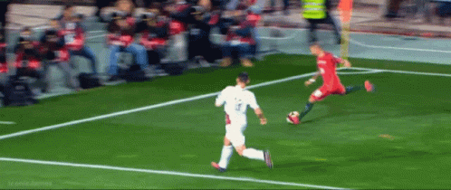 A Soccer Player With The Number 3 On His Shirt Is Kicking The Ball GIF