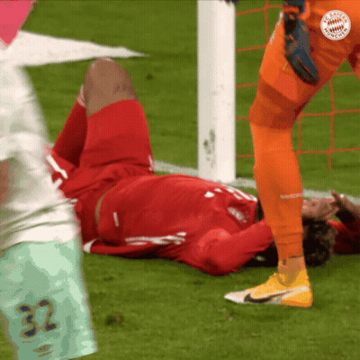 A Soccer Player With The Number 32 On His Shorts Is Laying On The Ground GIF