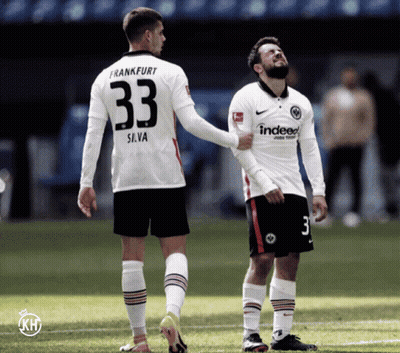 A Soccer Player With The Number 33 On His Back Talks To Another Player GIF