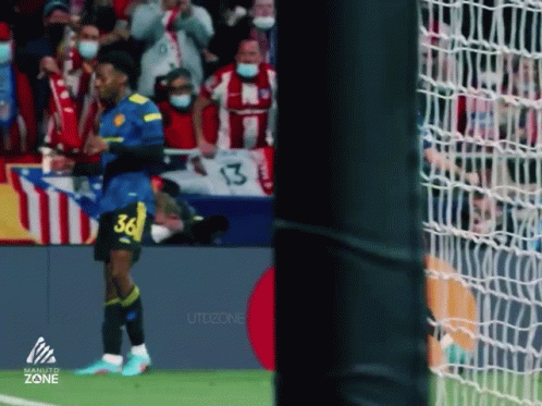 A Soccer Player With The Number 36 On His Jersey Stands On The Field . GIF