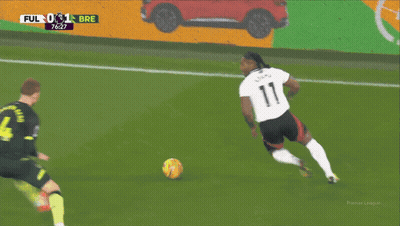 A Soccer Player With The Number 4 On His Back Kicks The Ball GIF