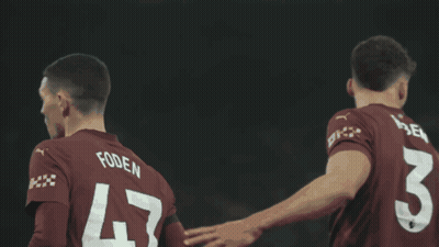 A Soccer Player With The Number 4 On His Back Kneeling On The Field GIF