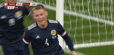 A Soccer Player With The Number 4 On His Jersey Is Celebrating A Goal GIF