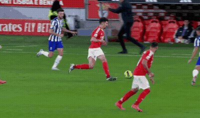 A Soccer Player With The Number 4 On His Jersey Is Kicking A Ball GIF
