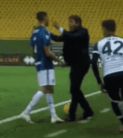 A Soccer Player With The Number 42 On His Jersey Talks To Another Player GIF