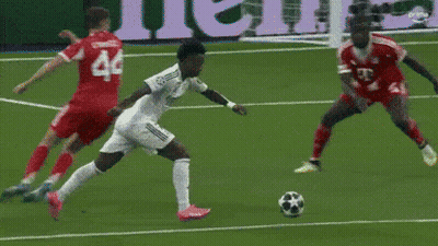 A Soccer Player With The Number 44 On His Jersey Is Trying To Kick The Ball GIF
