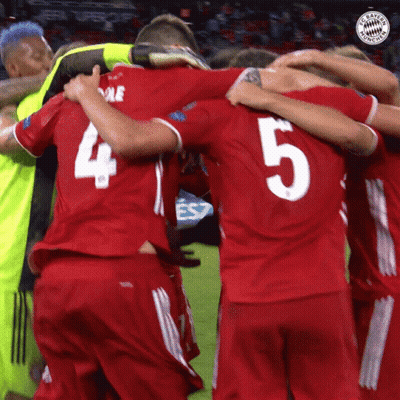 A Soccer Player With The Number 5 On His Back Is Hugging His Teammates GIF