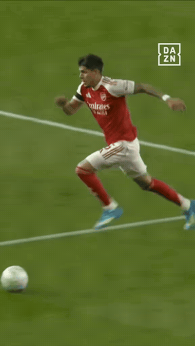 A Soccer Player With The Number 5 On His Back Is Kicking The Ball GIF