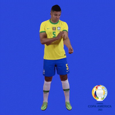 A Soccer Player With The Number 5 On His Jersey Stands In Front Of A Blue Background GIF