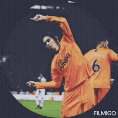 A Soccer Player With The Number 6 On His Jersey Is Dancing On The Field . GIF